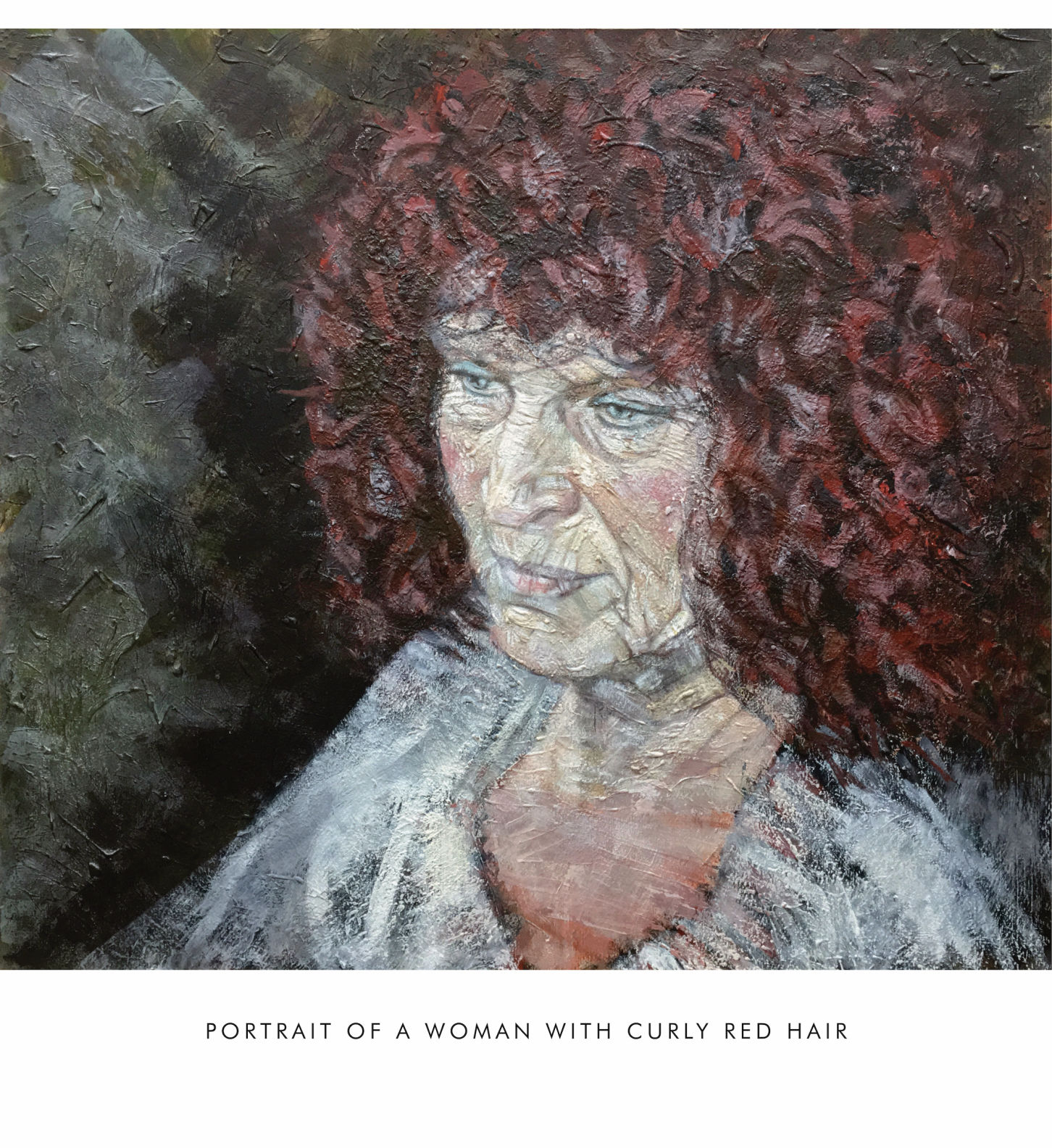 PORTRAIT OF A WOMAN WITH CURLY RED HAIR